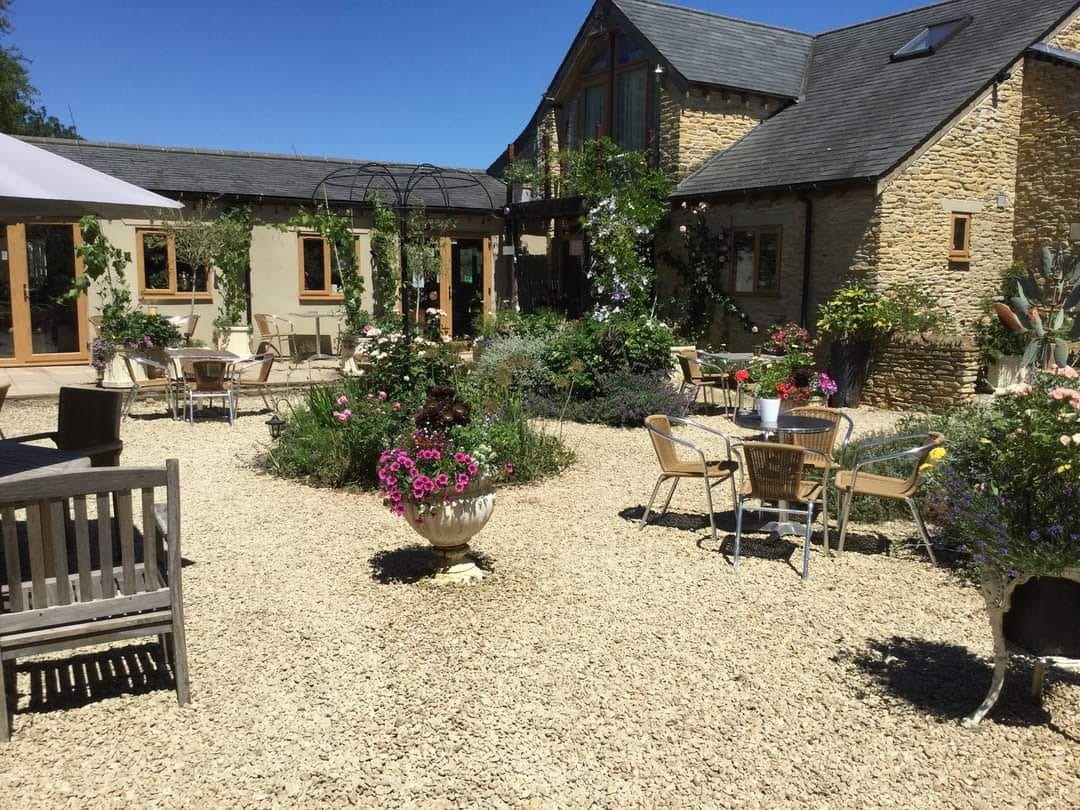 Al fresco dining in the flower-filled garden at Jennie's Kitchen